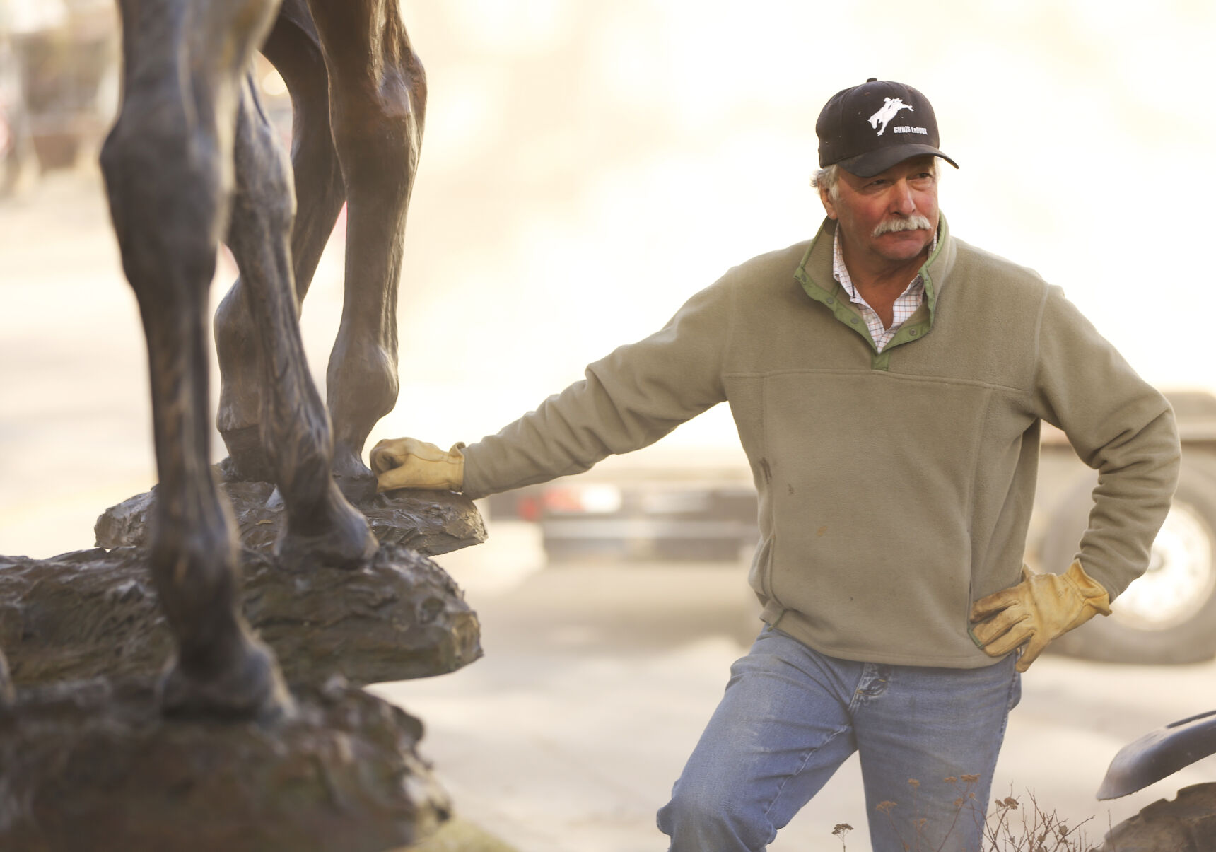 Mike Thomas rests on his hanging statue before they set it down
